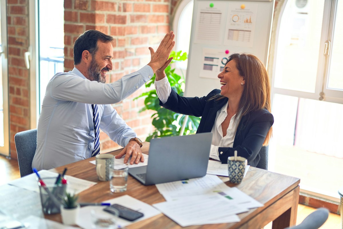 Local SEO Houston specialist reviewing campaign results with Houston business owner